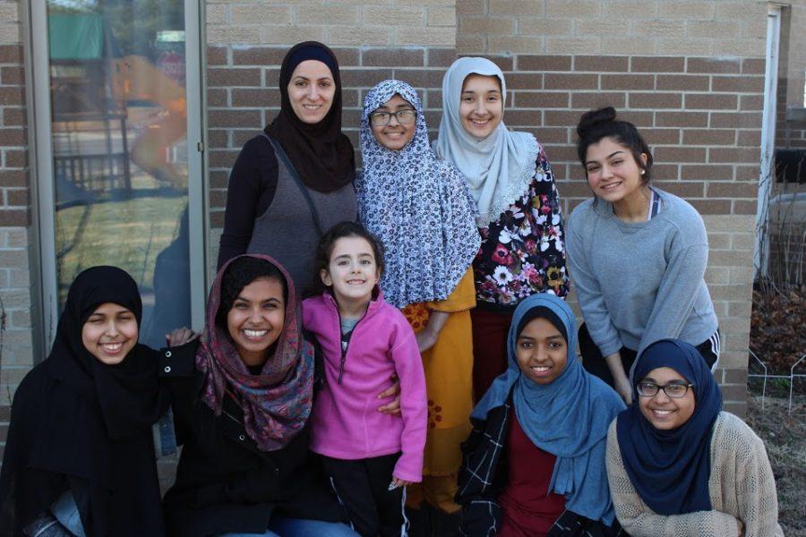The Youth Group from the local Bloomington Islamic Center pose outside their mosque.(from top left to bottom right) Amanda Adhami, Afiya Rana, Layan Hajiyer, Aziza Machnouk, Fathima Ahmed, Zayneb Ahmed, Huda Adhami , Haifa Mohamed, Amani Zaneer