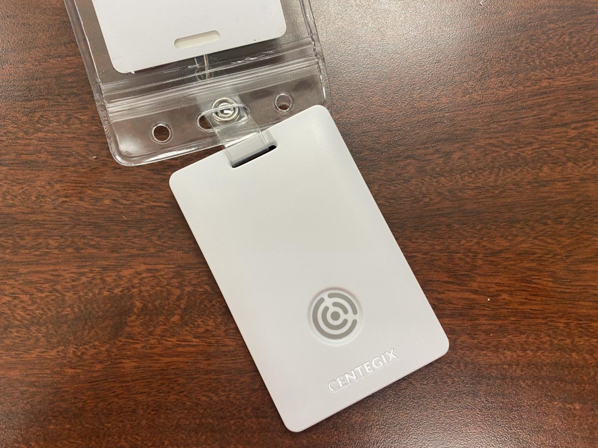 Each staff member will wear a badge like the one pictured with the panic button in Bloomington, Ind., Tuesday, Aug. 5, 2025.