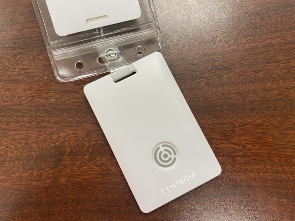 Each staff member will wear a badge like the one pictured with the panic button in Bloomington, Ind., Tuesday, Aug. 5, 2025.