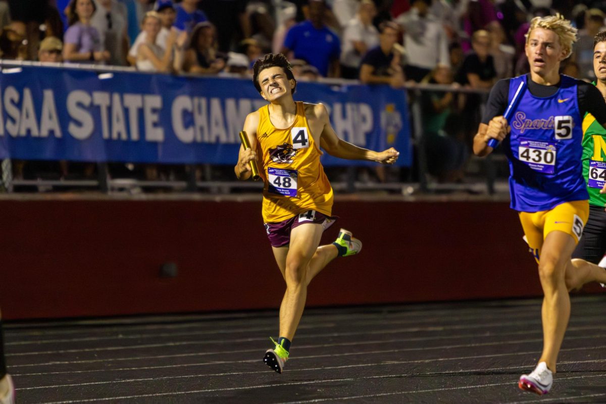 At the IHSAA State Championships on June 5 in Indianapolis, James Bosco (11) runs his leg of the relay. Bosco helps propel the Cougars to the team state championship.